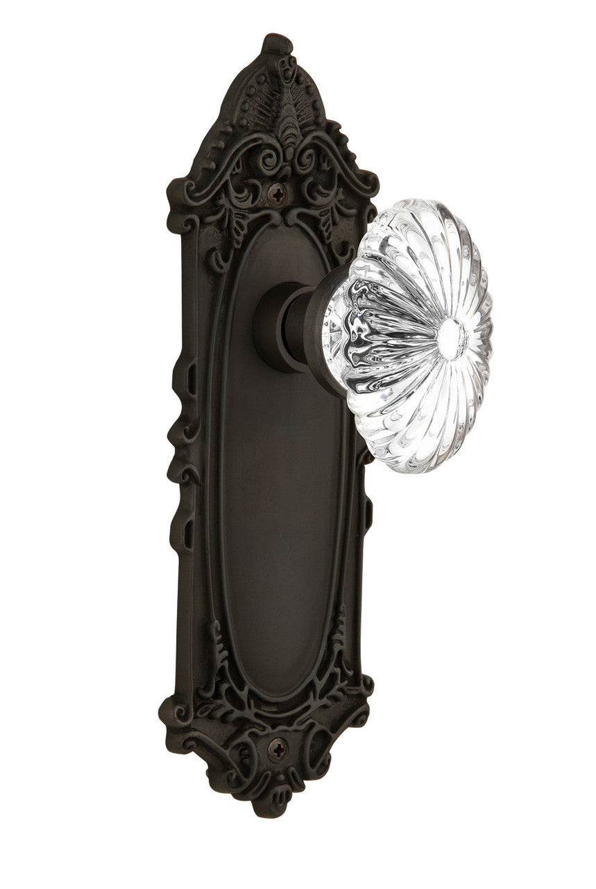 Nostalgic 712086: Victorian Backplate w/Oval Fluted Clear Glass Crystal Knob Privacy Door Set - Oil-Rubbed Bronze