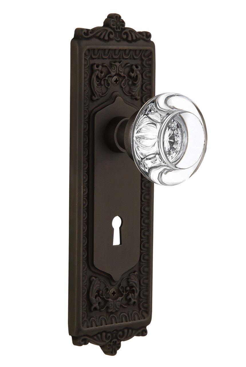 Nostalgic 712264: Egg & Dart Backplate w/Round Clear Glass Crystal Knob Passage Door Set - Oil-Rubbed Bronze