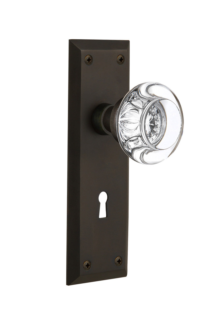Nostalgic 712278: New York Backplate w/Round Clear Glass Crystal Knob Passage Door Set - Oil-Rubbed Bronze