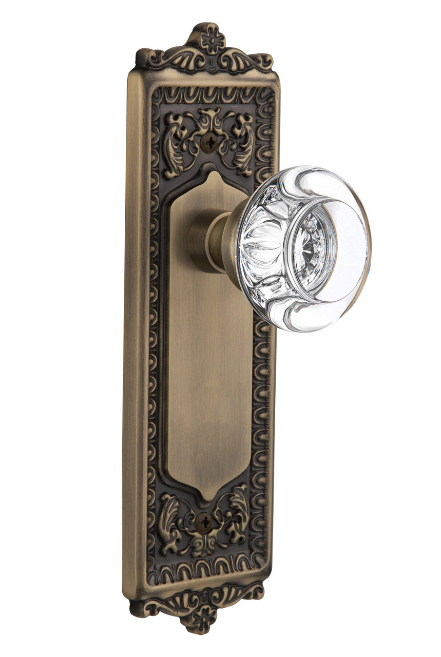 Nostalgic 712495: Egg & Dart Backplate w/Round Clear Glass Crystal Knob Privacy Door Set - Antique Brass