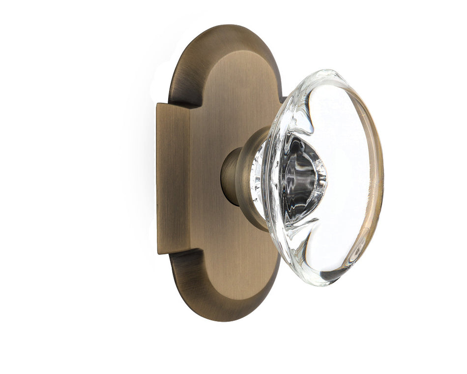 Nostalgic 712834: Cottage Backplate w/Oval Clear Glass Crystal Knob Passage Door Set - Antique Brass