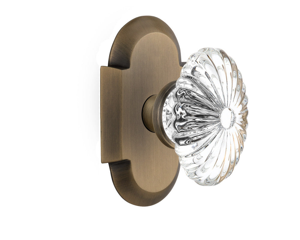 Nostalgic 712841: Cottage Backplate w/Oval Fluted Clear Glass Crystal Knob Passage Door Set - Antique Brass