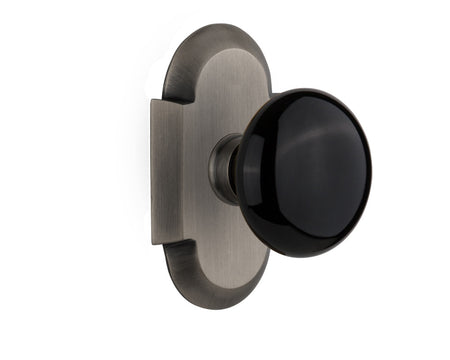 Nostalgic 712876: Cottage Backplate w/Black Porcelain Knob Passage Door Set - Antique Pewter
