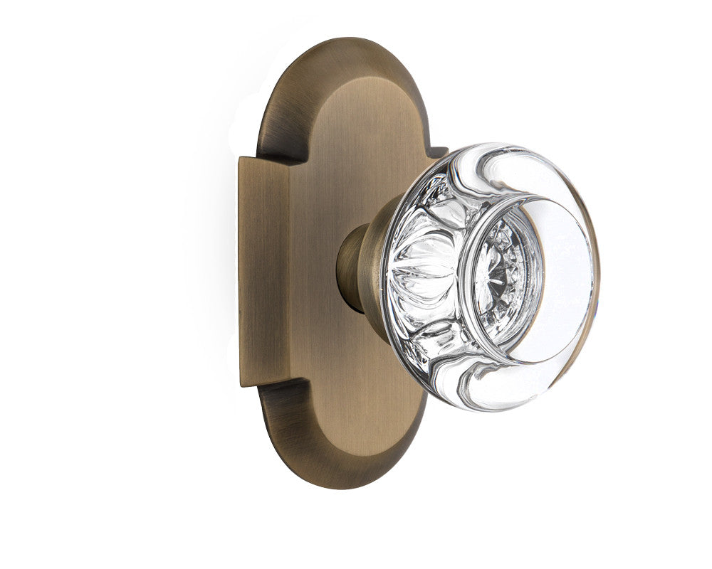 Nostalgic 712944: Cottage Backplate w/Round Clear Glass Crystal Knob Privacy Door Set - Antique Brass