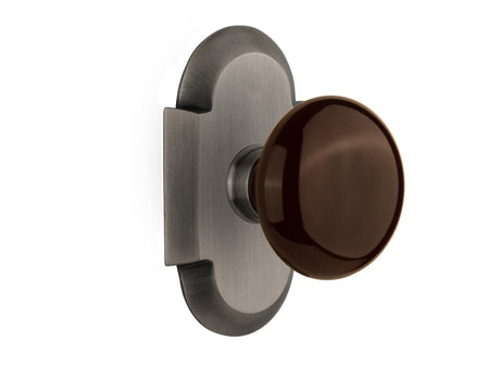 Nostalgic 712979: Cottage Backplate w/Brown Porcelain Knob Privacy Door Set - Antique Pewter