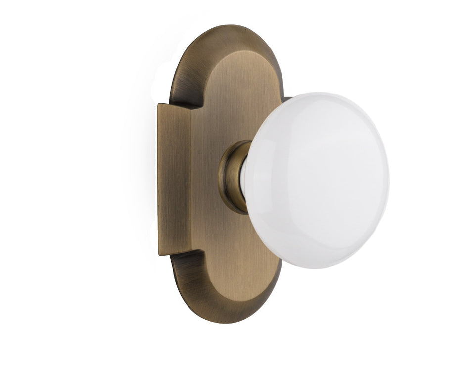 Nostalgic 712985: Cottage Backplate w/White Porcelain Knob Privacy Door Set - Antique Brass