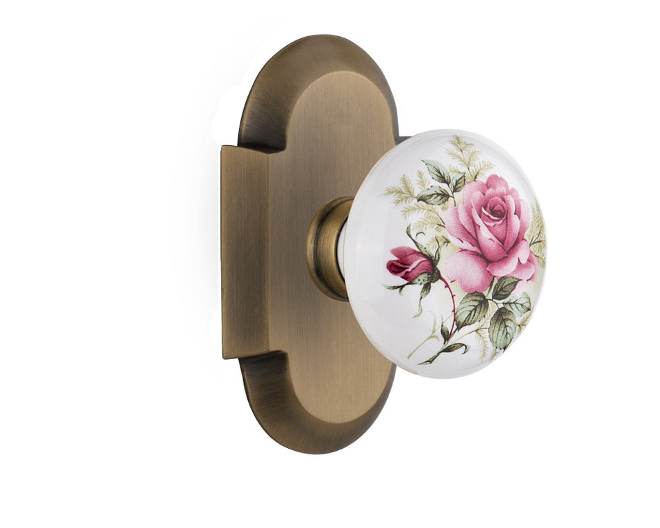 Nostalgic 713047: Cottage Backplate w/White Rose Porcelain Knob Single Dummy Door Set - Antique Brass