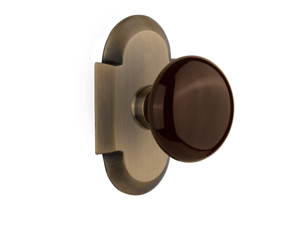 Nostalgic 713074: Cottage Backplate w/Brown Porcelain Knob Single Dummy Door Set - Antique Brass