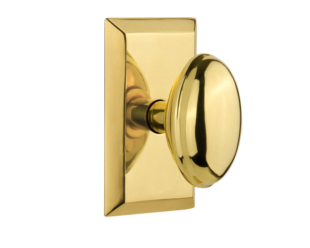 Nostalgic 713226: Studio Backplate w/Homestead Knob Passage Door Set - Polished Brass
