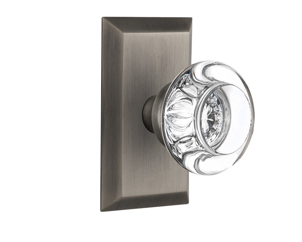 Nostalgic 713257: Studio Backplate w/Round Clear Glass Crystal Knob Passage Door Set - Antique Pewter