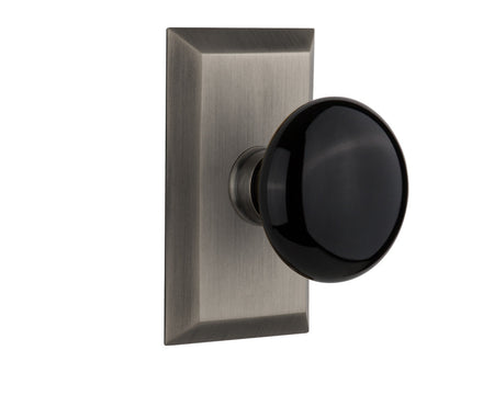 Nostalgic 713284: Studio Backplate w/Black Porcelain Knob Passage Door Set - Antique Pewter