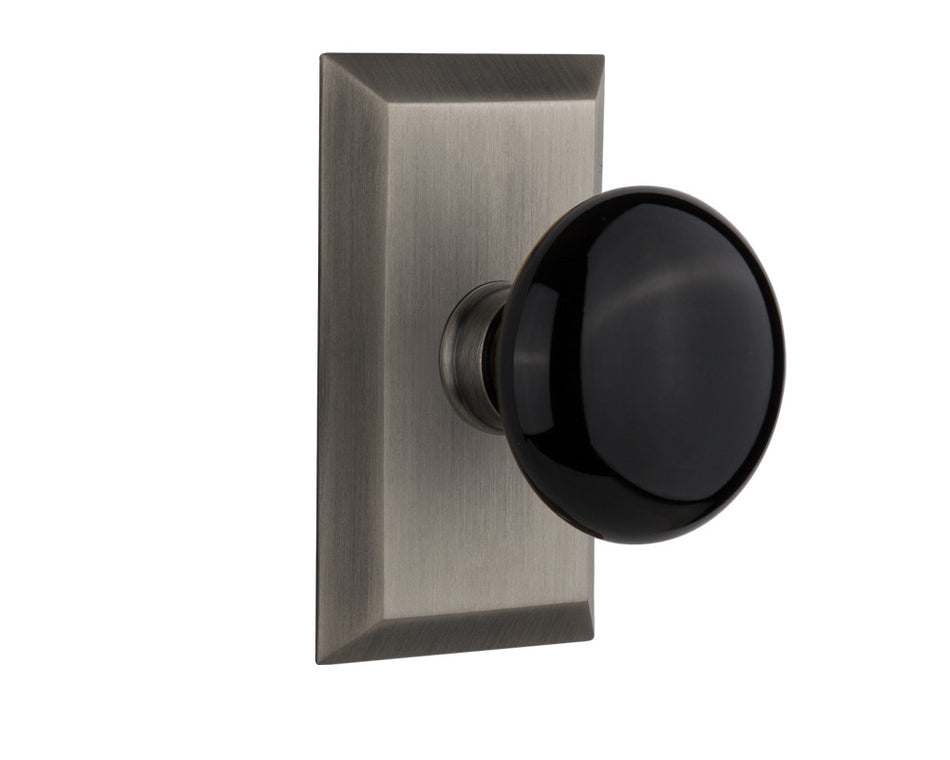 Nostalgic 713284: Studio Backplate w/Black Porcelain Knob Passage Door Set - Antique Pewter