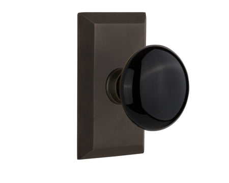 Nostalgic 713286: Studio Backplate w/Black Porcelain Knob Passage Door Set - Oil-Rubbed Bronze