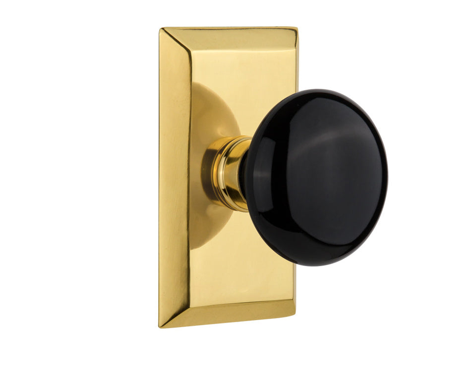 Nostalgic 713287: Studio Backplate w/Black Porcelain Knob Passage Door Set - Polished Brass