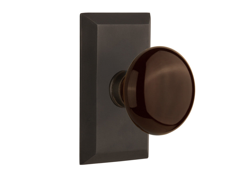 Nostalgic 713293: Studio Backplate w/Brown Porcelain Knob Passage Door Set - Oil-Rubbed Bronze