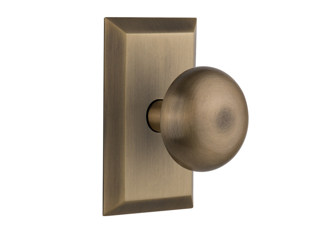 Nostalgic 713331: Studio Backplate w/New York Knob Privacy Door Set - Antique Brass