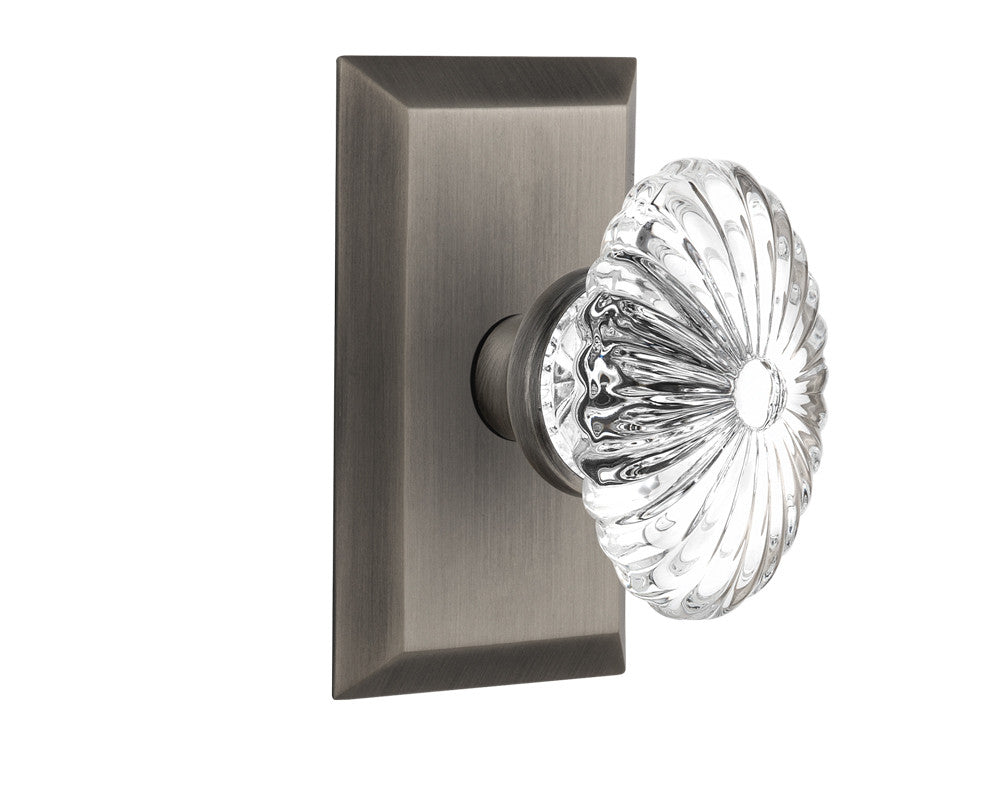 Nostalgic 713346: Studio Backplate w/Oval Fluted Clear Glass Crystal Knob Privacy Door Set - Antique Pewter