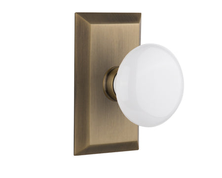 Nostalgic 713489: Studio Backplate w/White Porcelain Knob Single Dummy Door Set - Antique Brass