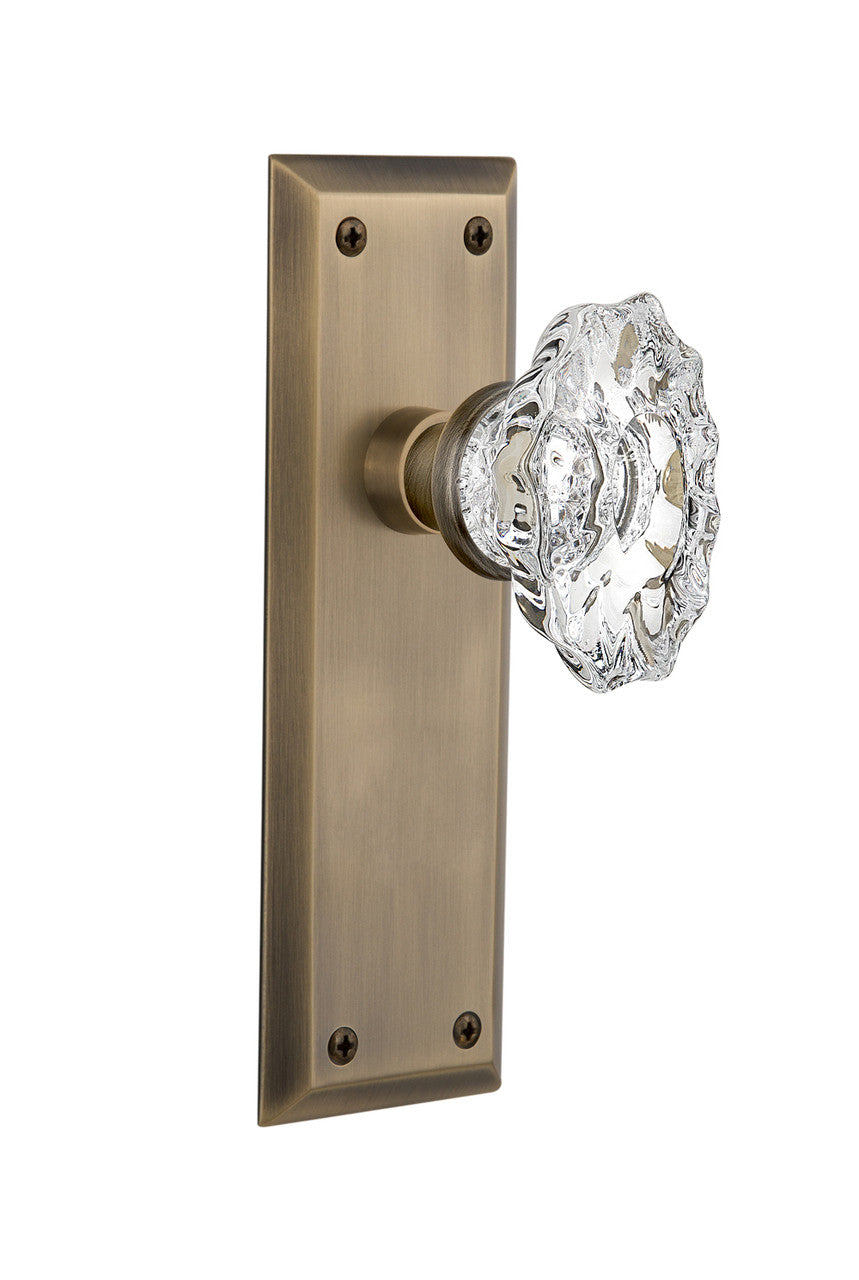 Nostalgic 713640: New York Backplate w/Chateau Knob Passage Door Set - Antique Brass