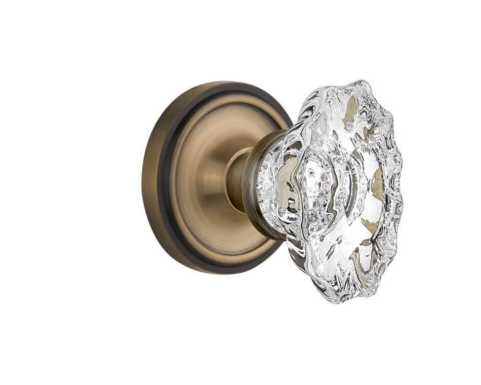 Nostalgic 713912: Classic Rosette w/Chateau Knob Privacy Door Set - Antique Brass