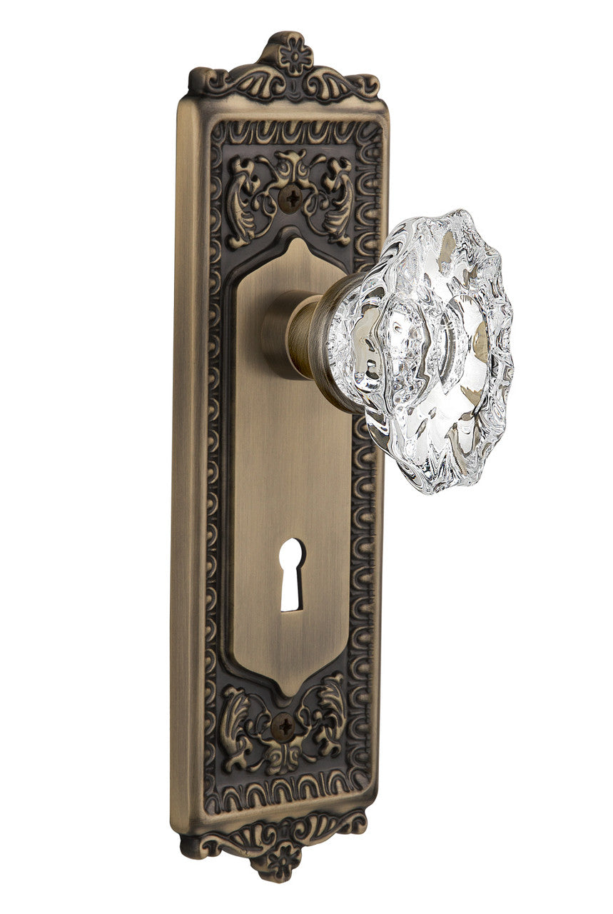 Nostalgic 713973: Egg & Dart Backplate w/Chateau Knob Privacy Door Set - Antique Brass