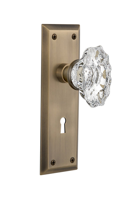 Nostalgic 713985: New York Backplate w/Chateau Knob Privacy Door Set - Antique Brass