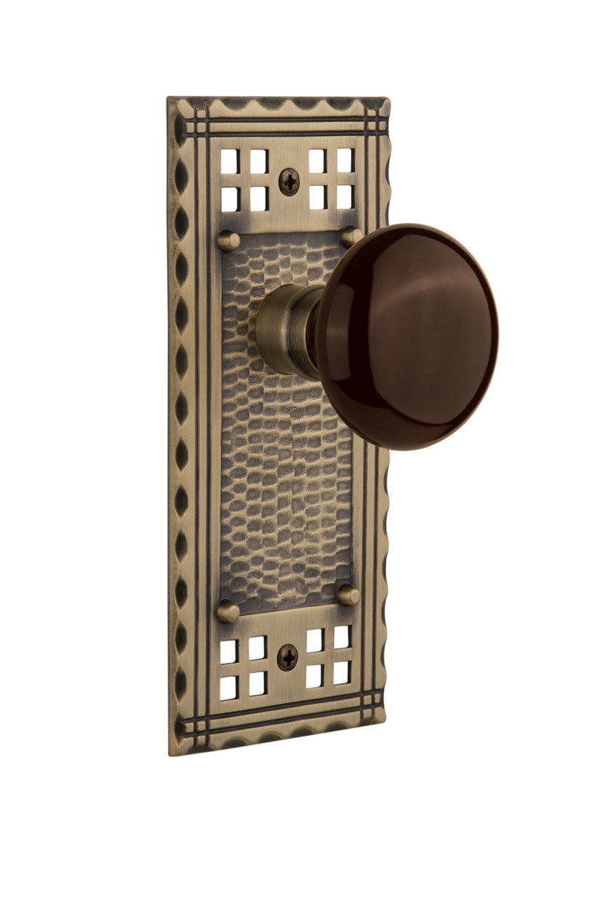 Nostalgic 715266: Craftsman Backplate w/Brown Porcelain Knob Passage Door Set - Antique Brass