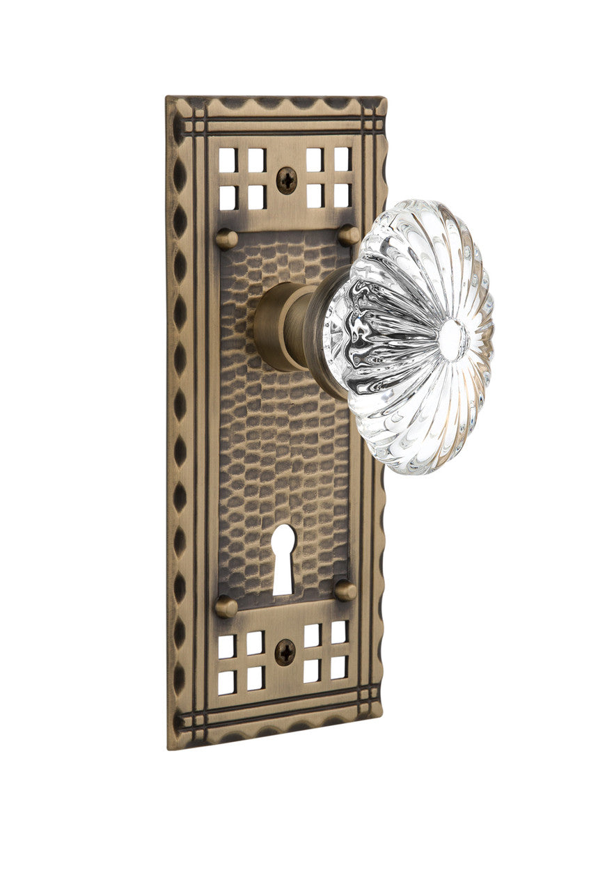 Nostalgic 715338: Craftsman Backplate w/Oval Fluted Clear Glass Crystal Knob Passage Door Set - Antique Brass