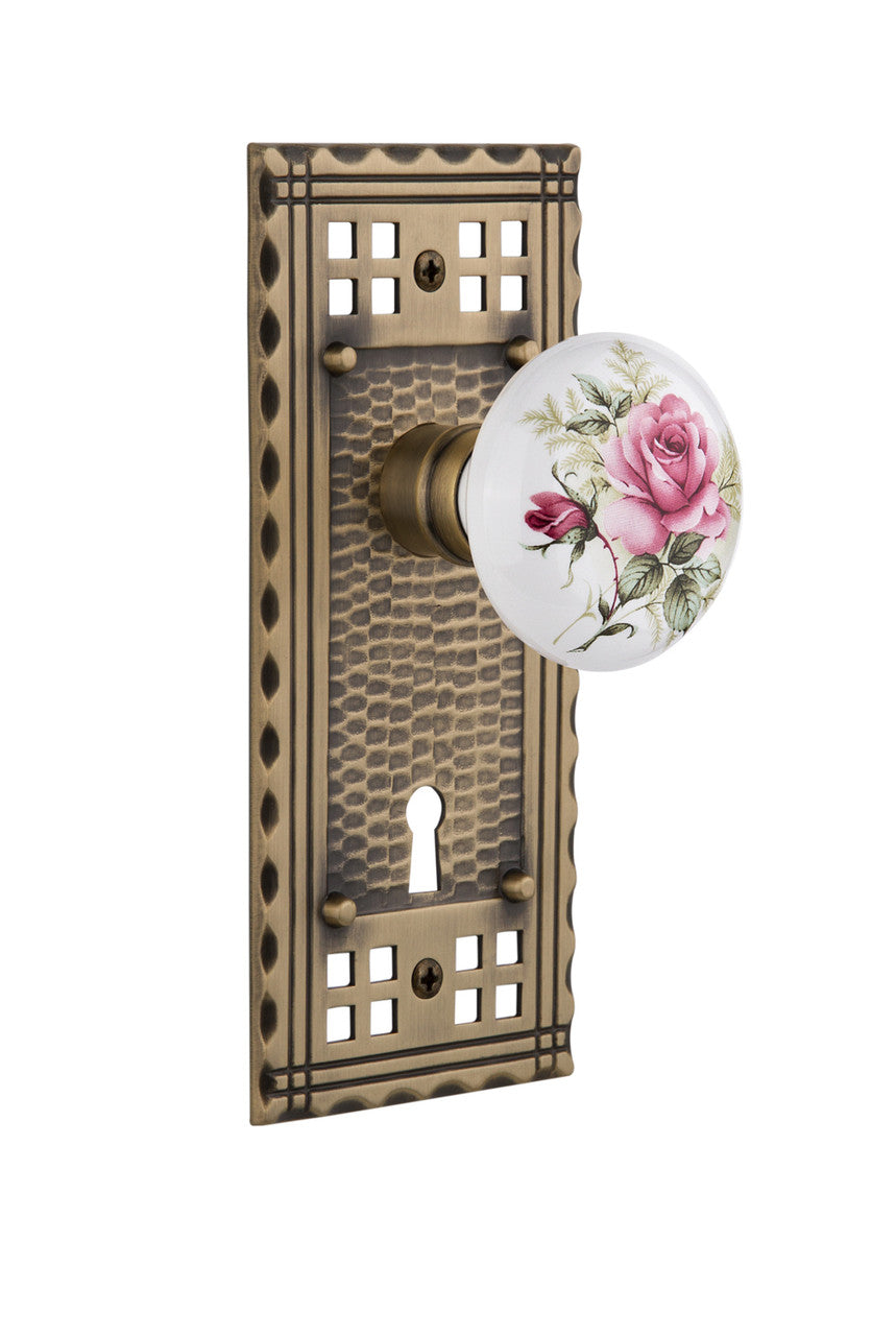 Nostalgic 715342: Craftsman Backplate w/White Rose Porcelain Knob Passage Door Set - Antique Brass