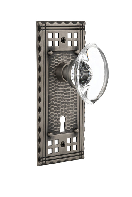 Nostalgic 715719: Craftsman Backplate w/Oval Clear Glass Crystal Knob Privacy Door Set - Antique Pewter