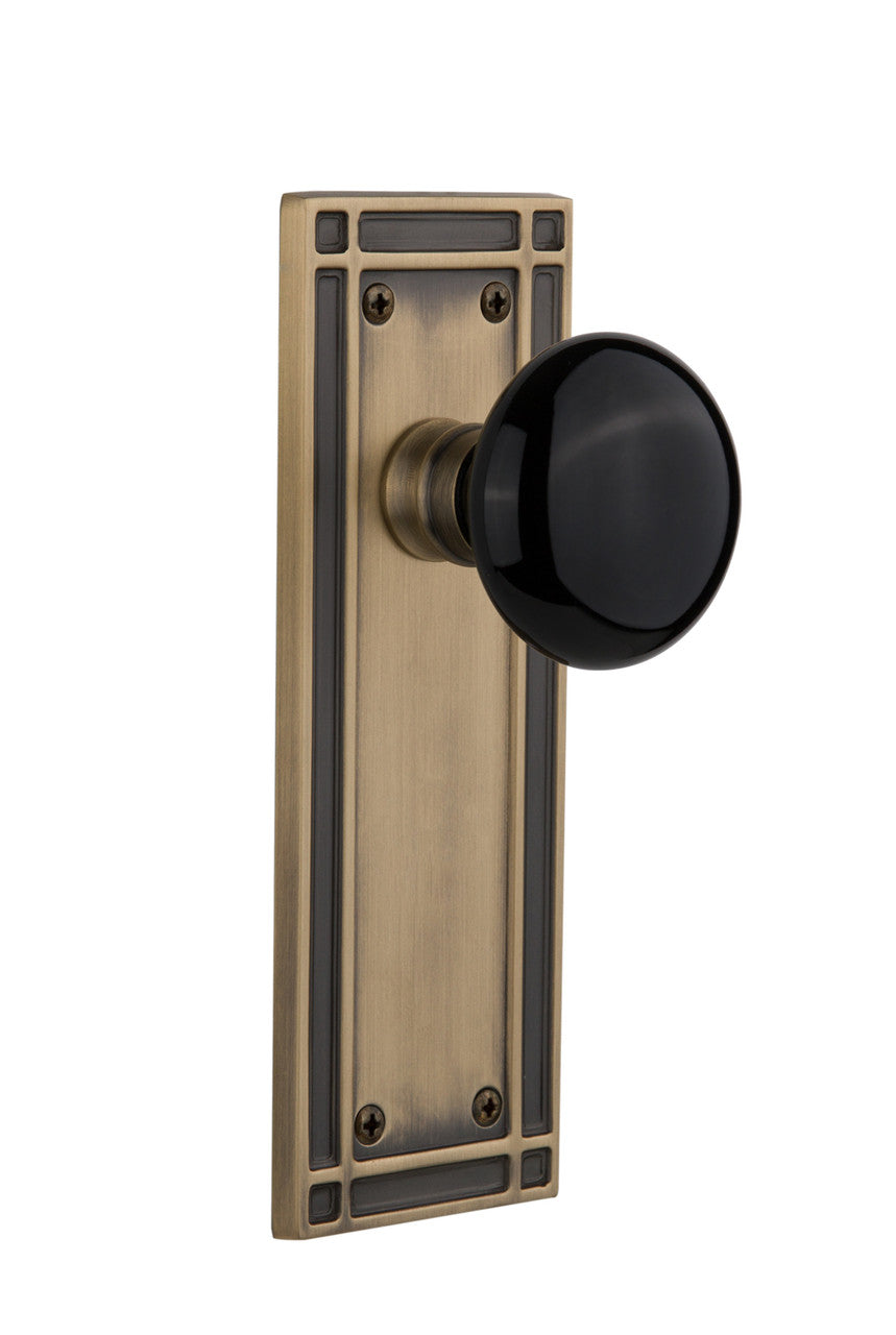 Nostalgic 715838: Mission Backplate w/Black Porcelain Knob Passage Door Set - Antique Brass