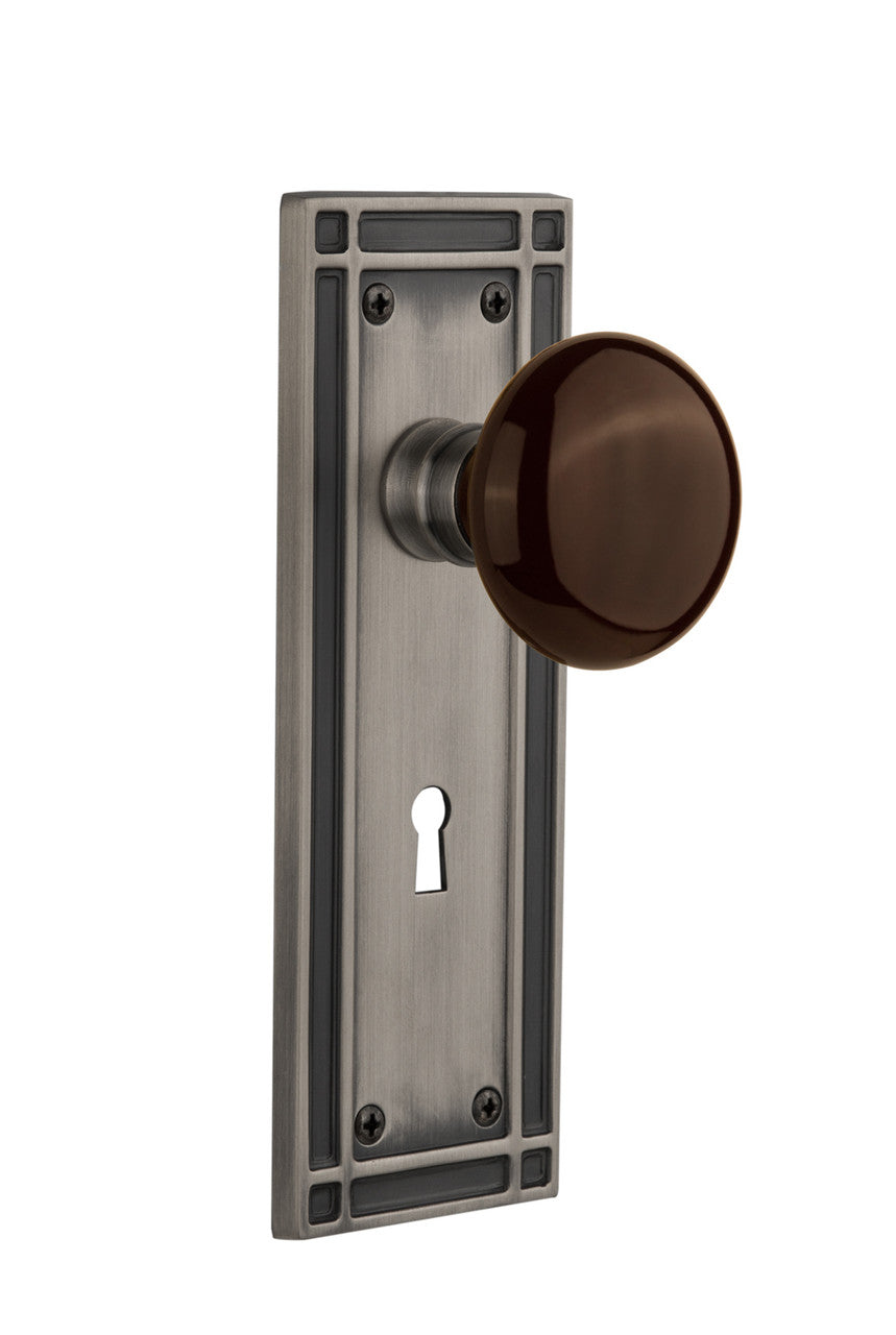 Nostalgic 715907: Mission Backplate w/Brown Porcelain Knob Passage Door Set - Antique Pewter
