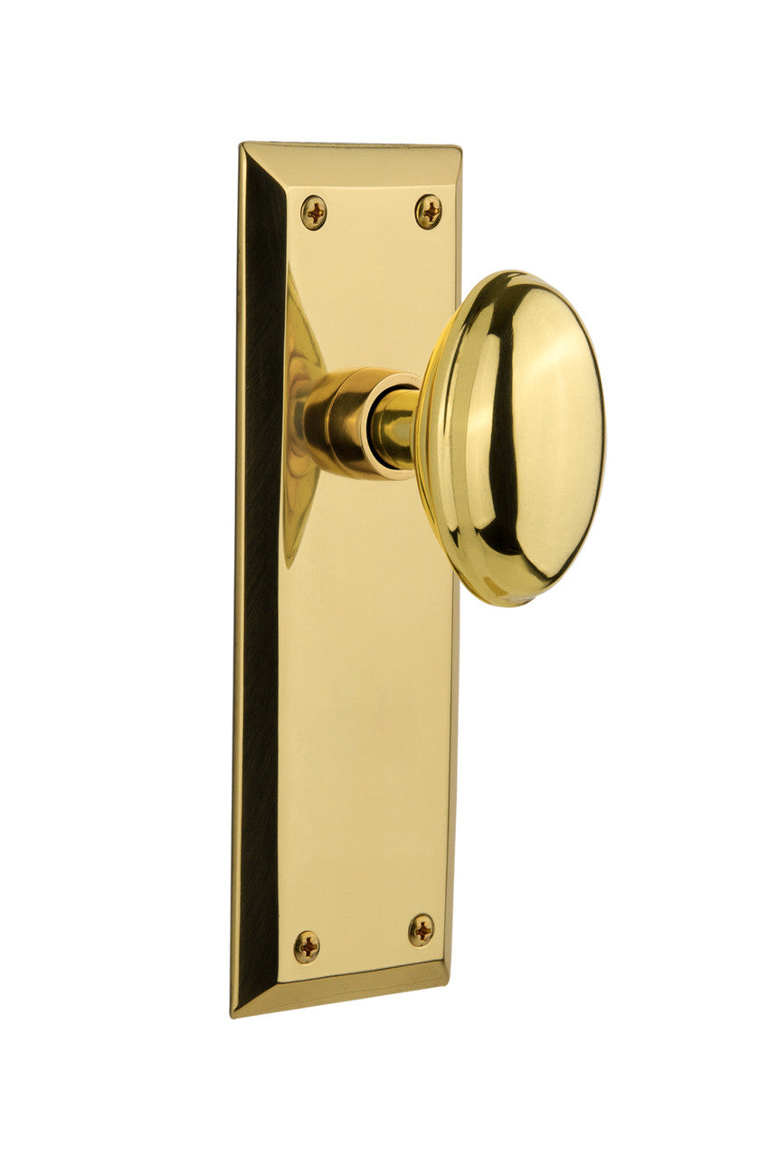 Nostalgic 717032: New York Backplate w/Homestead Knob Passage Door Set - Unlacquered Brass