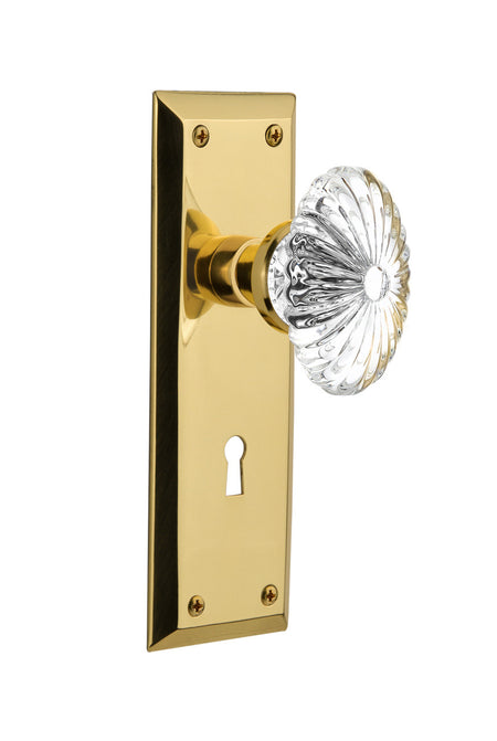 Nostalgic 717080: New York Backplate w/Oval Fluted Clear Glass Crystal Knob Privacy Door Set - Unlacquered Brass