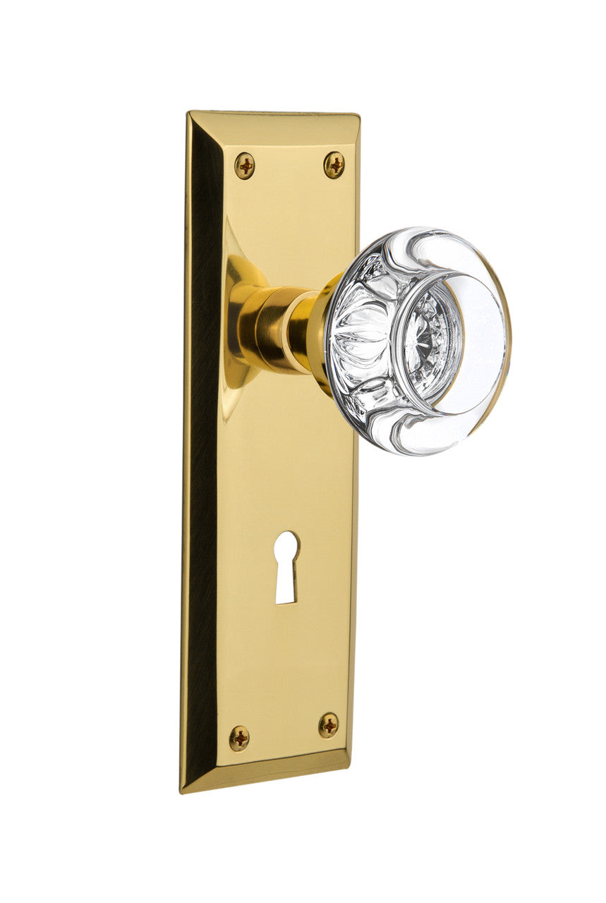Nostalgic 717081: New York Backplate w/Round Clear Glass Crystal Knob Privacy Door Set - Unlacquered Brass