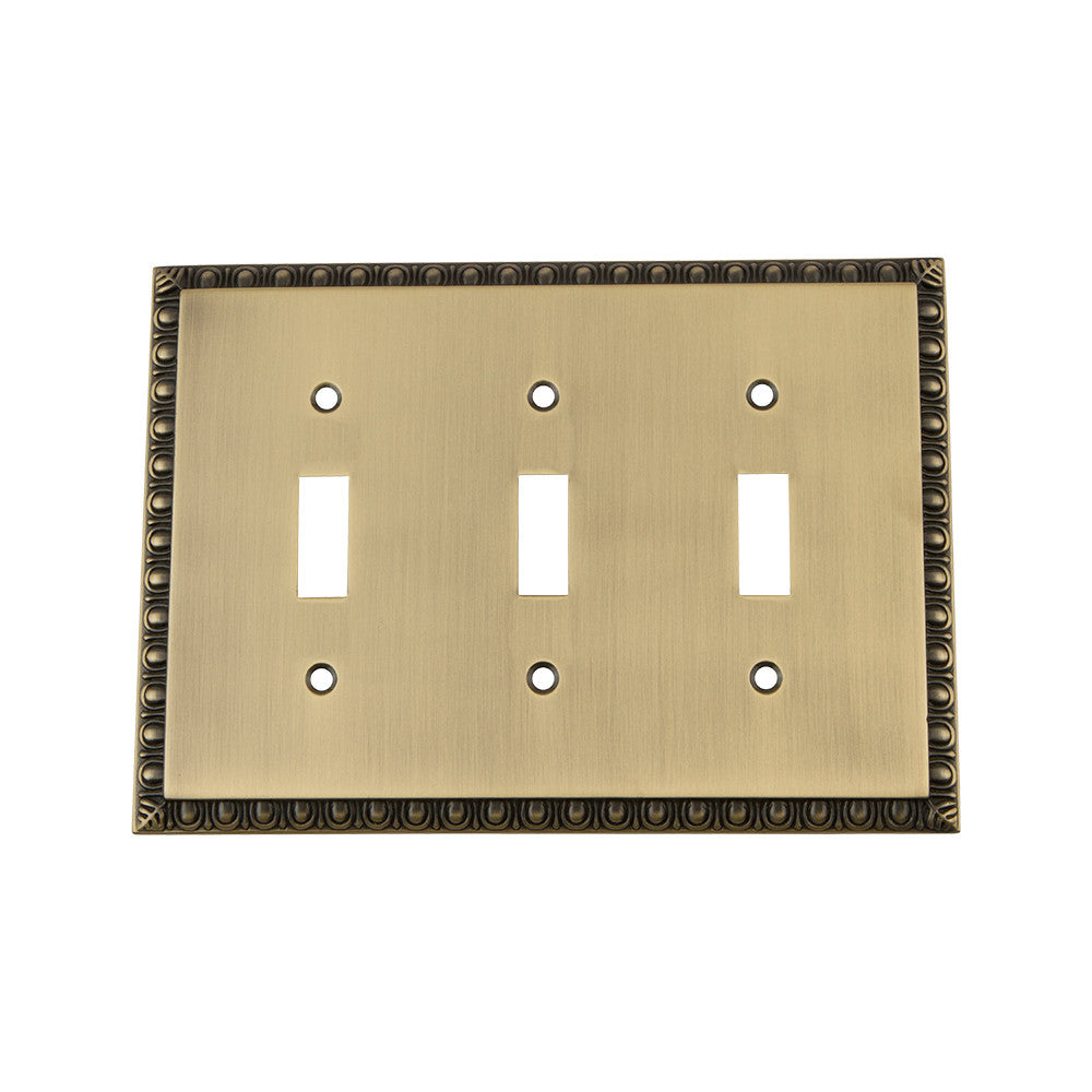 Nostalgic Warehouse 719760: Egg & Dart Triple Toggle Switchplate - Antique Brass
