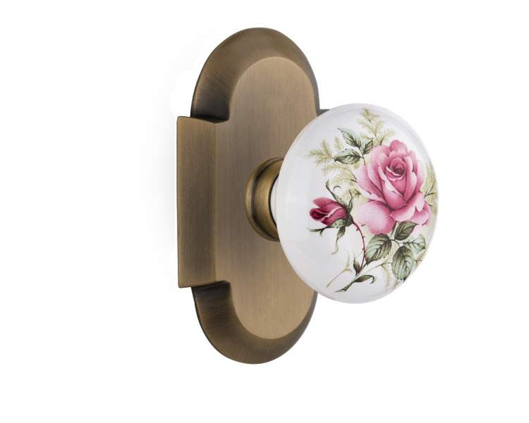 Nostalgic 713047: Cottage Backplate w/White Rose Porcelain Knob Single Dummy Door Set - Antique Brass
