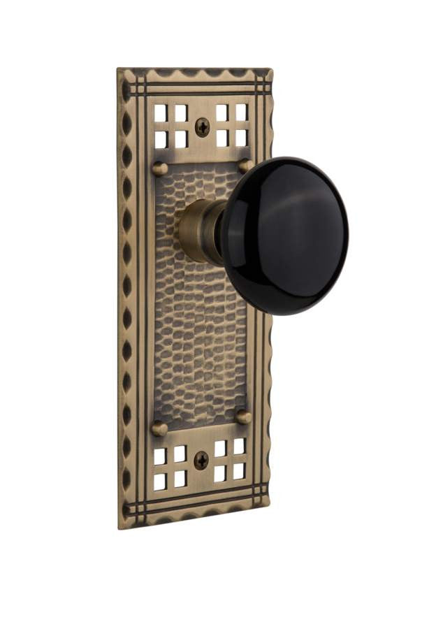 Nostalgic 715262: Craftsman Backplate w/Black Porcelain Knob Passage Door Set - Antique Brass