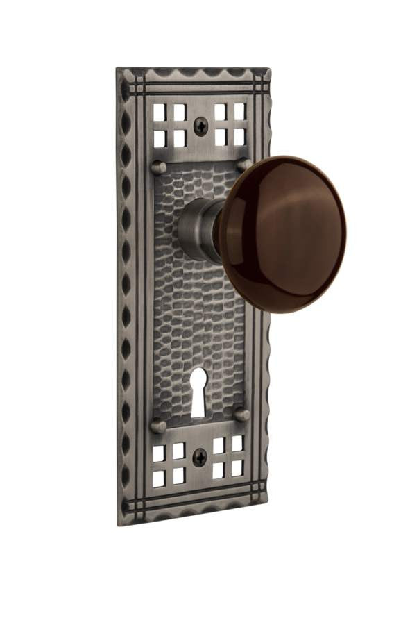 Nostalgic 715331: Craftsman Backplate w/Brown Porcelain Knob Passage Door Set - Antique Pewter