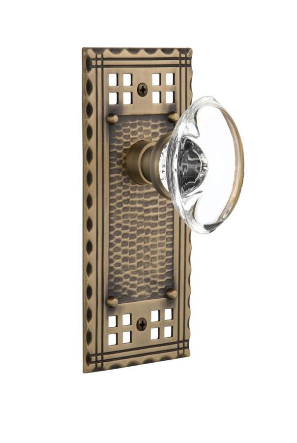 Nostalgic 715398: Craftsman Backplate w/Oval Clear Glass Crystal Knob Single Dummy Door Set - Antique Brass