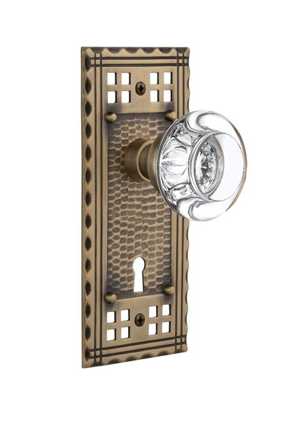 Nostalgic 715730: Craftsman Backplate w/Round Clear Glass Crystal Knob Privacy Door Set - Antique Brass