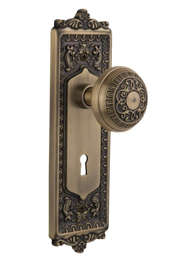 Nostalgic 701906: Egg & Dart Backplate w/Egg & Dart Knob Single Dummy Door Set - Antique Brass