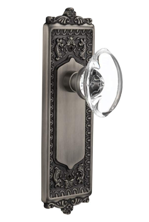 Nostalgic 711616: Egg & Dart Backplate w/Oval Clear Glass Crystal Knob Privacy Door Set - Antique Pewter