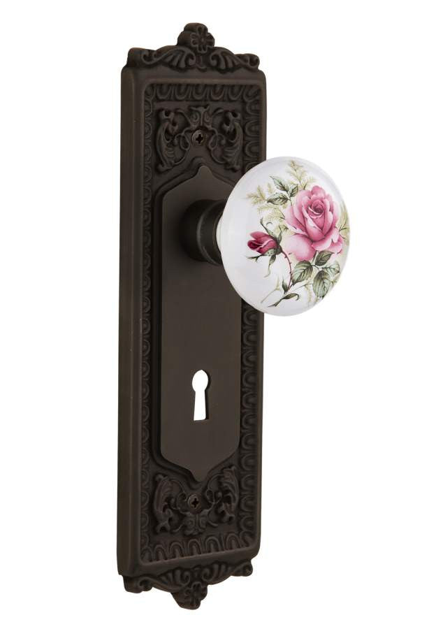 Nostalgic 711232: Egg & Dart Backplate w/White Rose Porcelain Knob Privacy Door Set - Oil-Rubbed Bronze