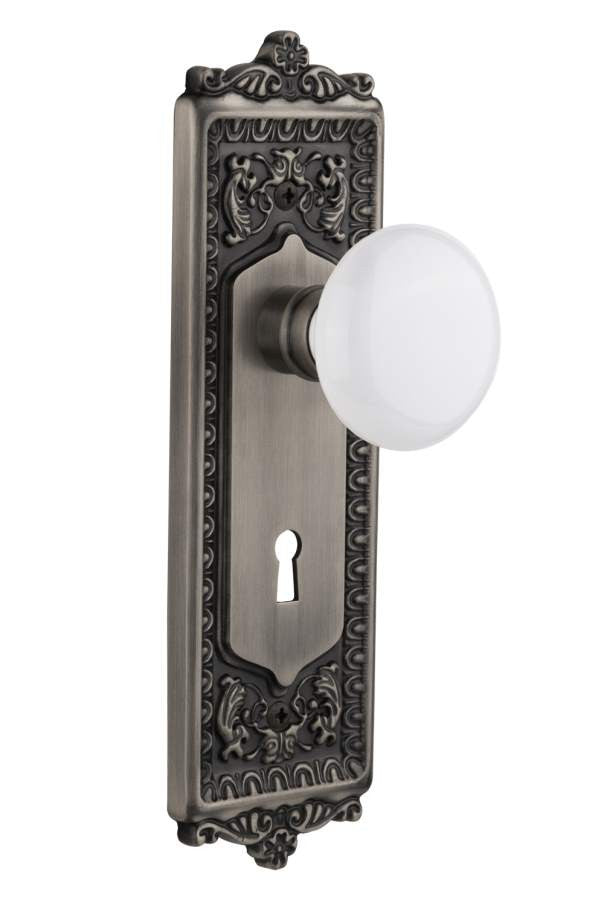 Nostalgic 704282: Egg & Dart Backplate w/White Porcelain Knob Passage Door Set - Antique Pewter
