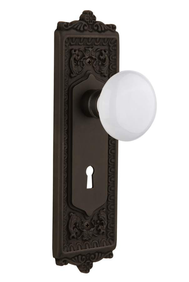 Nostalgic 704287: Egg & Dart Backplate w/White Porcelain Knob Single Dummy Door Set - Oil-Rubbed Bronze