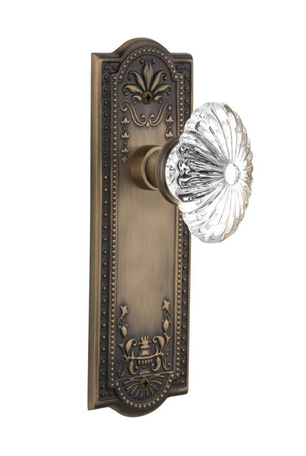 Nostalgic 711774: Meadows Backplate w/Oval Fluted Clear Glass Crystal Knob Passage Door Set - Antique Brass