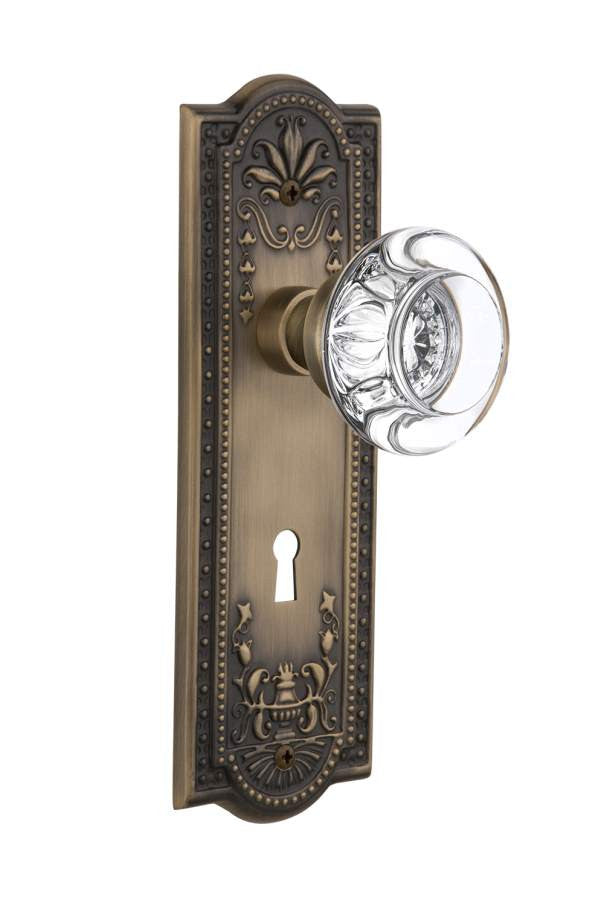 Nostalgic 712556: Meadows Backplate w/Round Clear Glass Crystal Knob Privacy Door Set - Antique Brass