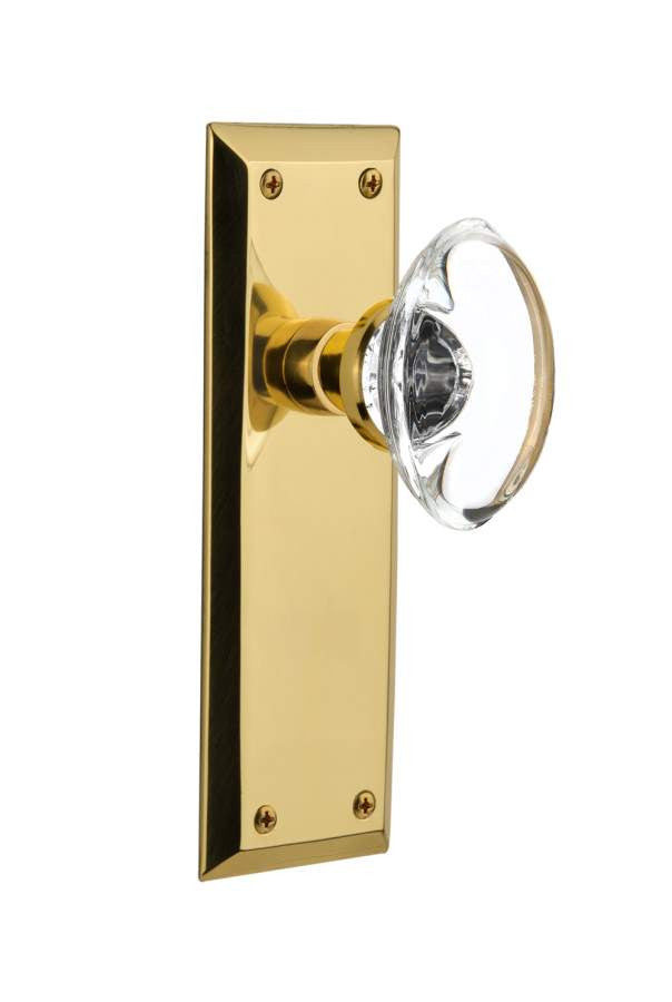 Nostalgic 717066: New York Backplate w/Oval Clear Glass Crystal Knob Privacy Door Set - Unlacquered Brass