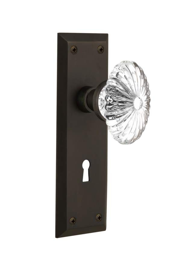 Nostalgic 712126: New York Backplate w/Oval Fluted Clear Glass Crystal Knob Privacy Door Set - Oil-Rubbed Bronze